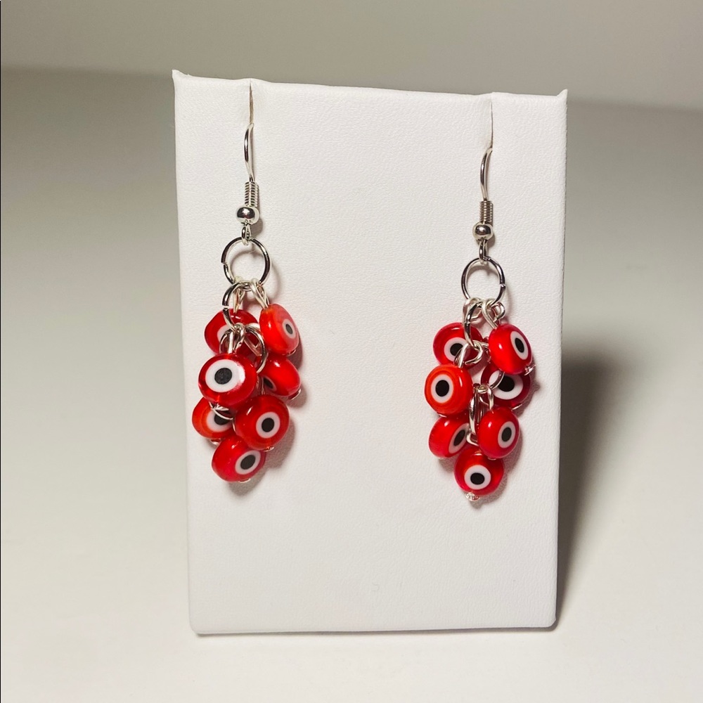 Red drop evil eye earrings